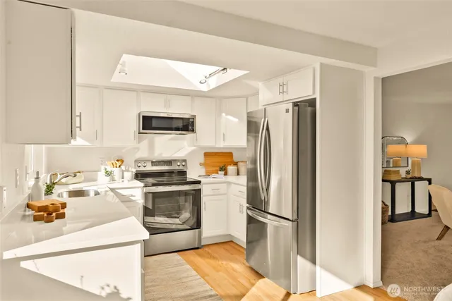 a kitchen with a refrigerator stove and sink