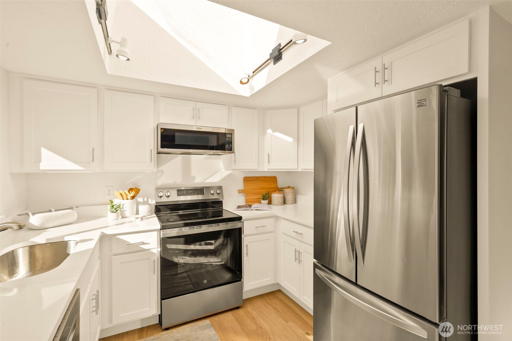 4730 228th Street Southeast Bothell, WA 98021 - Photo 8 of 37 a kitchen with a refrigerator stove and sink