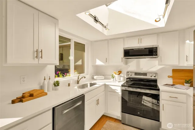 a kitchen with a sink and a window