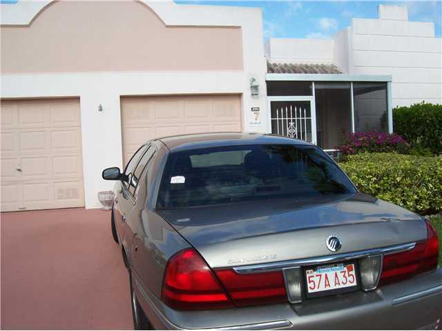 18761 Garbo Terrace, Unit 7 Boca Raton, FL 33496 - Photo 1 of 11 a car parked in front of a house