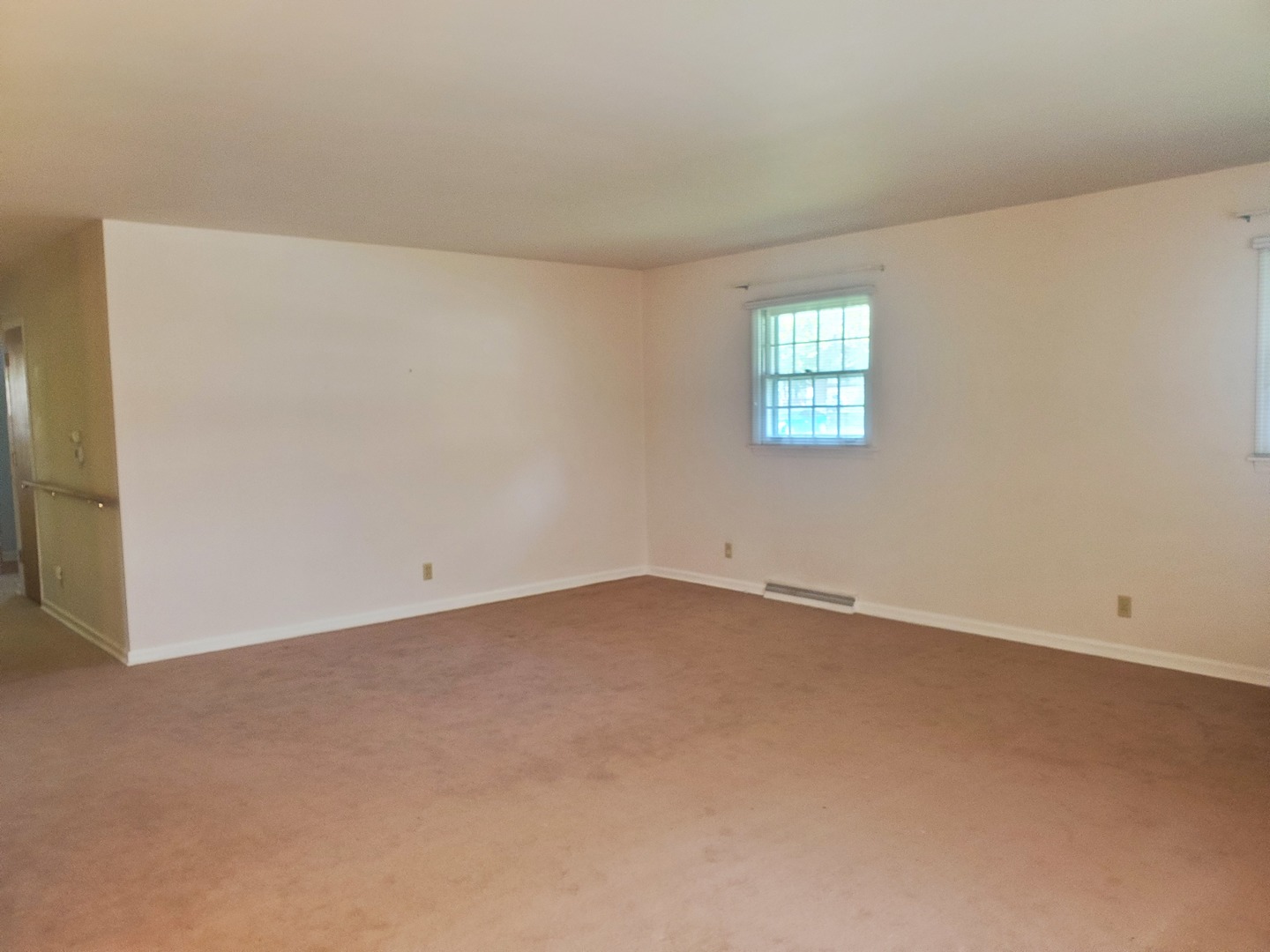1910 Robert Drive Champaign, IL 61821 - Photo 3 of 10 an empty room with a window
