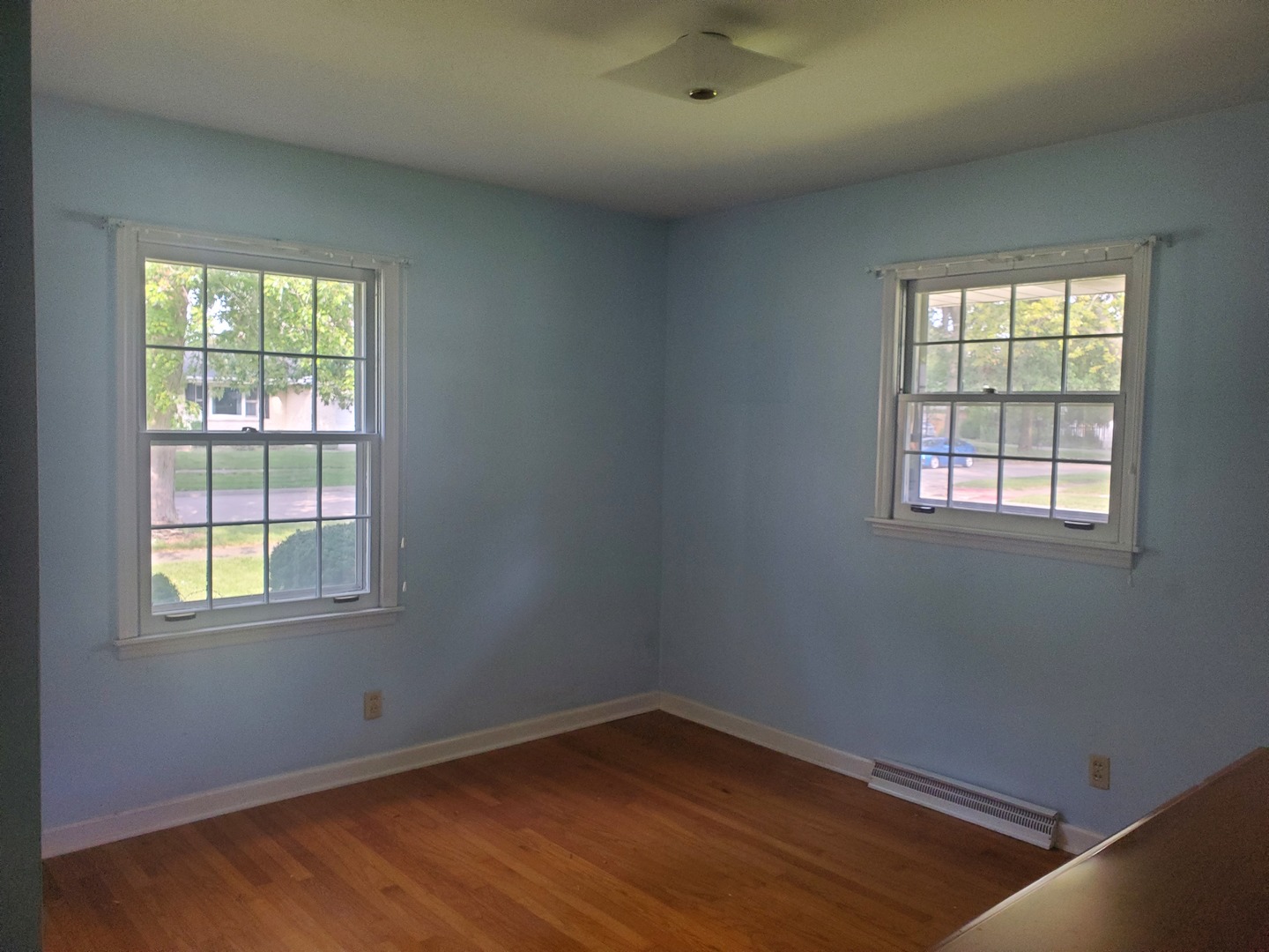 1910 Robert Drive Champaign, IL 61821 - Photo 10 of 10 an empty room with wooden floor and windows