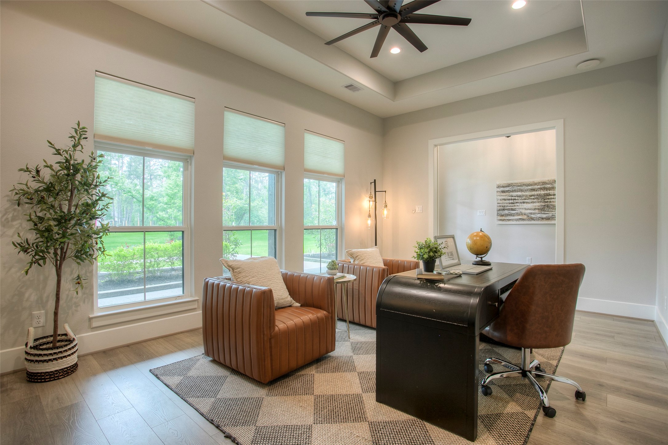 12915 Oak Barrel Road Willis, TX 77378 - Photo 7 of 46 A bright and inviting home office with large windows to let all the natural light in.