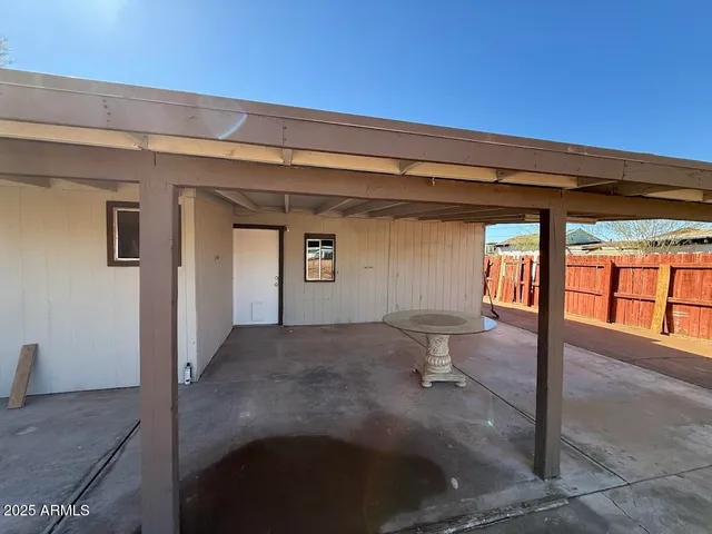 a view of a hallway with wooden floor and a fireplace