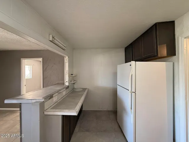 a kitchen with refrigerator a sink and dishwasher