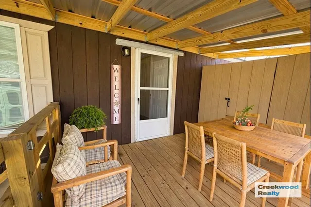 a view of an outdoor dining space with furniture