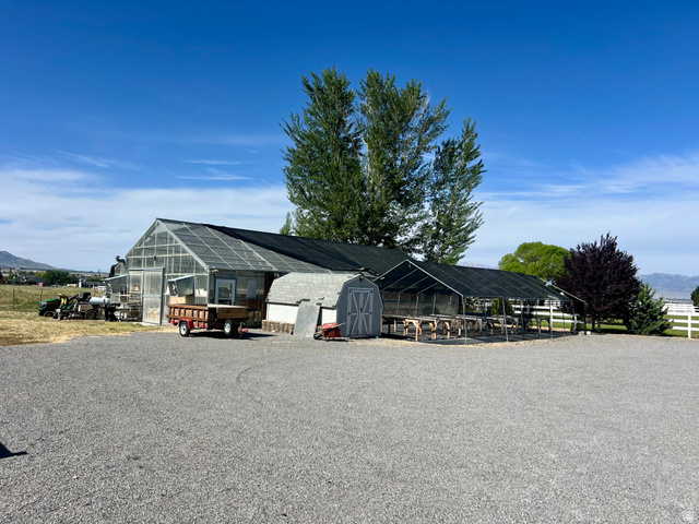 812 East Bates Cyn Road Tooele, UT 84074 - Photo 109 of 144 Expansive gravel parking area with multiple large greenhouse structures