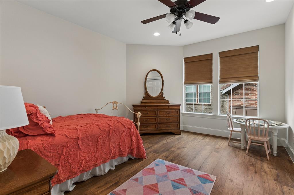 1600 Abrams Road, Unit 22 Dallas, TX 75214 - Photo 13 of 38 a bedroom with a bed and wooden floor