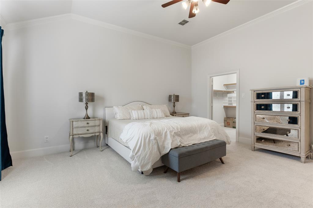 1600 Abrams Road, Unit 22 Dallas, TX 75214 - Photo 19 of 38 a spacious bedroom with a bed and a chandelier