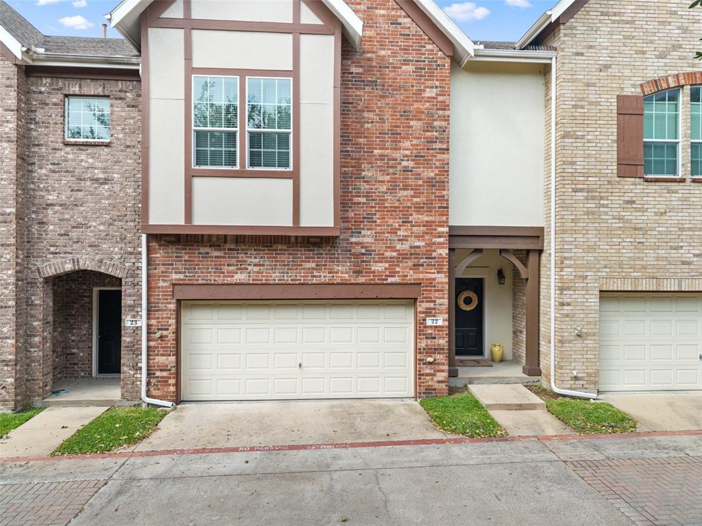 1600 Abrams Road, Unit 22 Dallas, TX 75214 - Photo 2 of 38 a front view of a house with a yard and garage