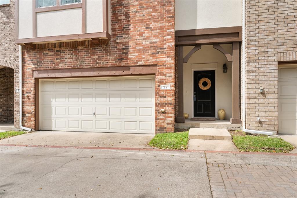 1600 Abrams Road, Unit 22 Dallas, TX 75214 - Photo 29 of 38 a front view of a house with a yard and garage