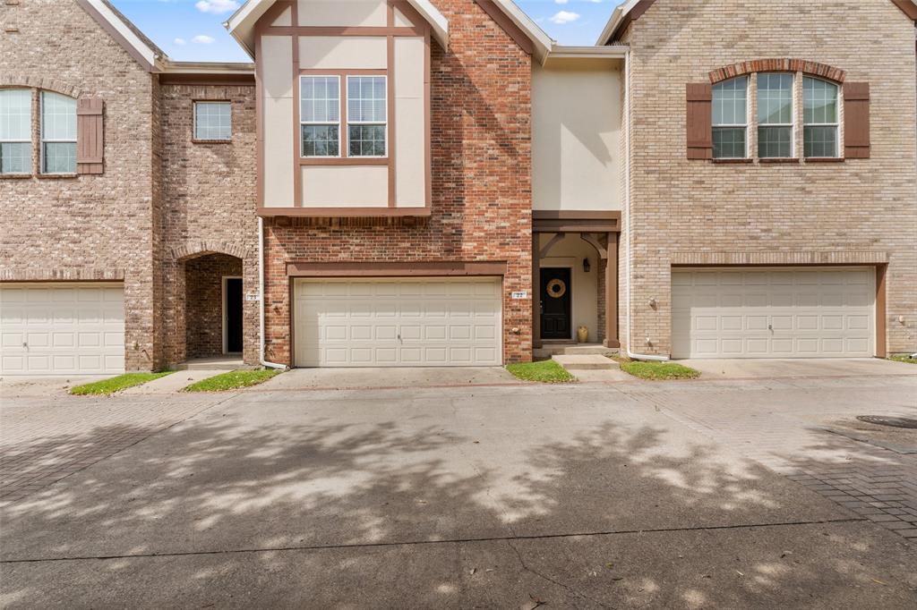 1600 Abrams Road, Unit 22 Dallas, TX 75214 - Photo 3 of 38 a front view of a house with a road and a garage