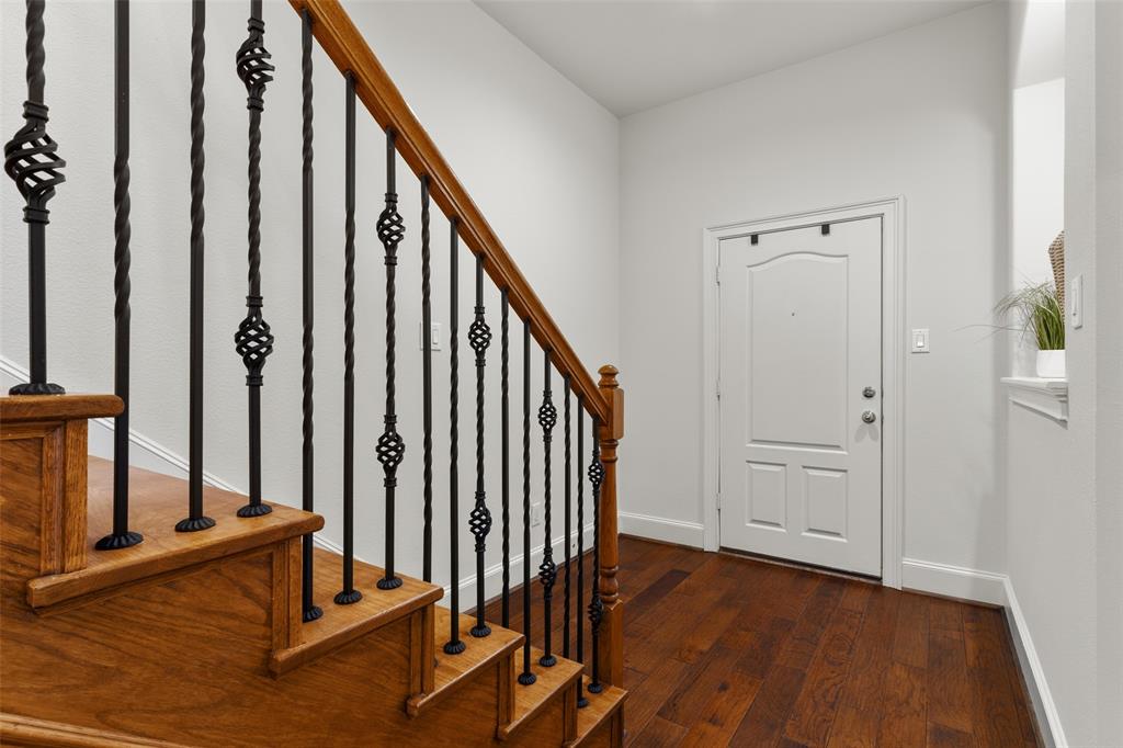 1600 Abrams Road, Unit 22 Dallas, TX 75214 - Photo 4 of 38 a view of a hallway with wooden floor and staircase