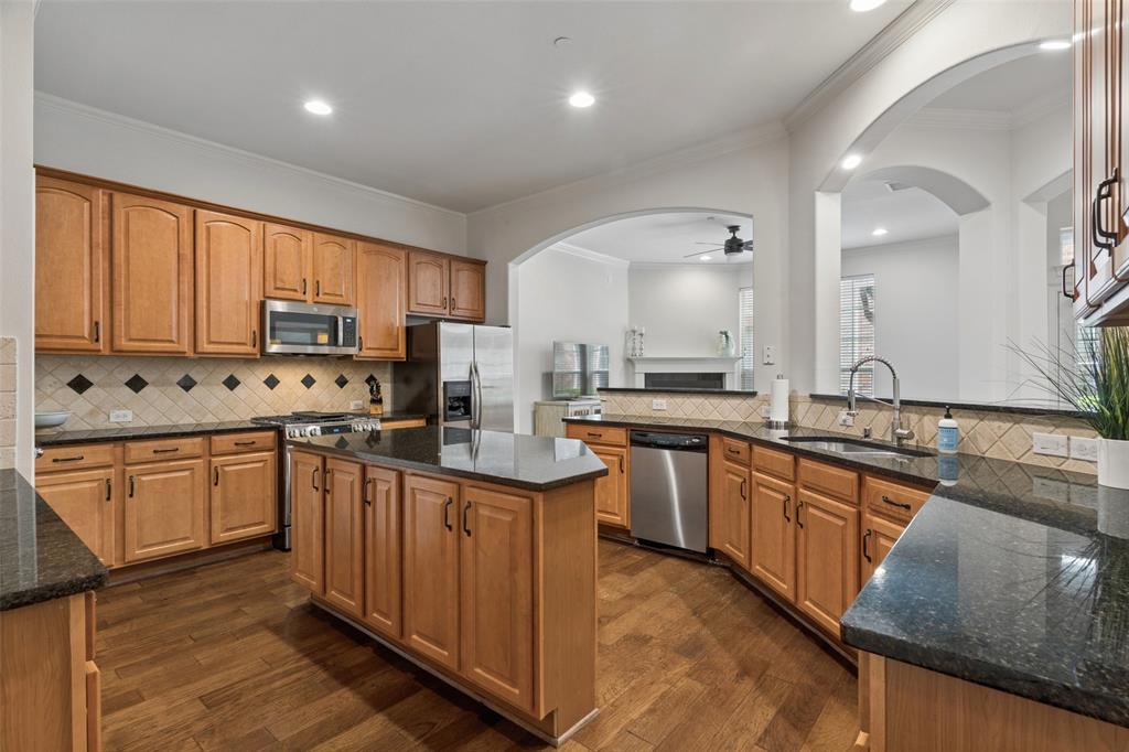 1600 Abrams Road, Unit 22 Dallas, TX 75214 - Photo 5 of 38 a kitchen with stainless steel appliances granite countertop sink stove top oven and cabinets