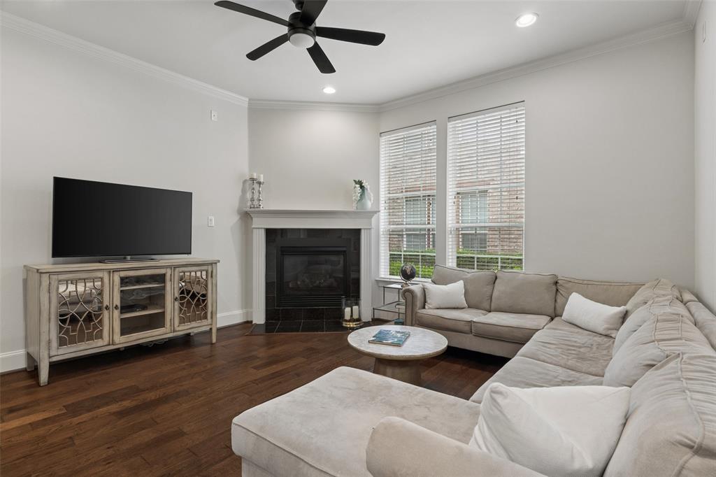 1600 Abrams Road, Unit 22 Dallas, TX 75214 - Photo 10 of 38 a living room with furniture a flat screen tv and a fireplace