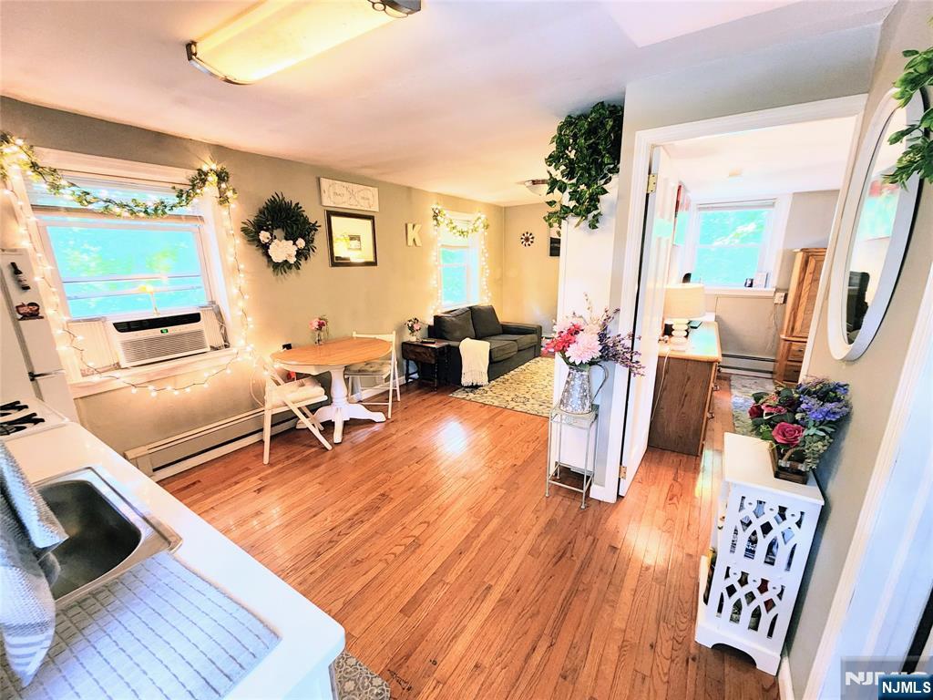 274 Franklin Turnpike, Unit GARAGE APART Ridgewood, NJ 07450 - Photo 2 of 11 a living room with furniture and a flat screen tv