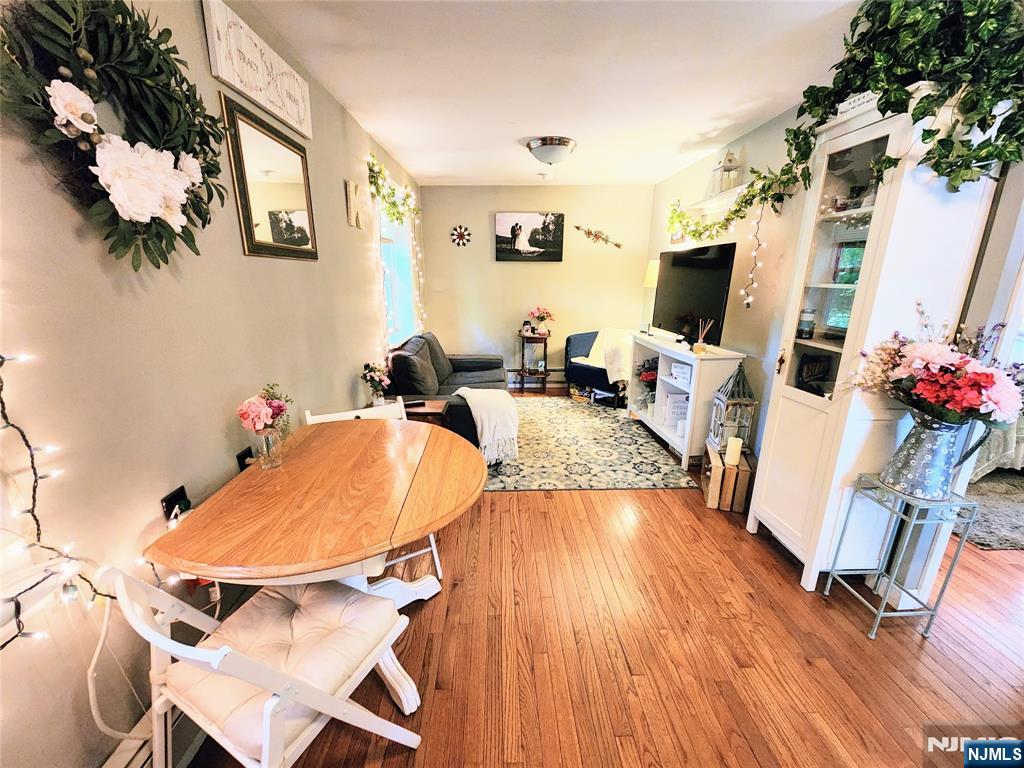 274 Franklin Turnpike, Unit GARAGE APART Ridgewood, NJ 07450 - Photo 3 of 11 a living room with furniture a flat screen tv and a table