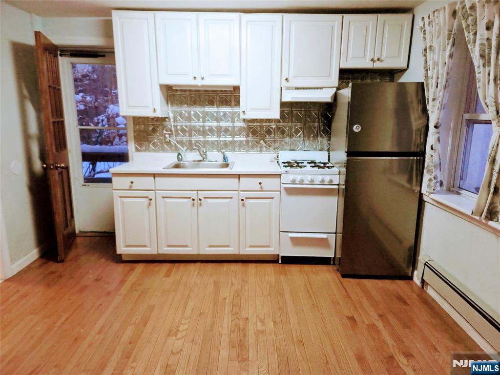 274 Franklin Turnpike, Unit GARAGE APART Ridgewood, NJ 07450 - Photo 4 of 11 a kitchen with stainless steel appliances a refrigerator and a stove top oven