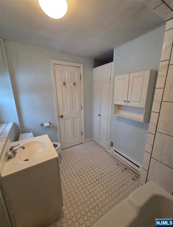 274 Franklin Turnpike, Unit GARAGE APART Ridgewood, NJ 07450 - Photo 9 of 11 a room with a bed and cabinets