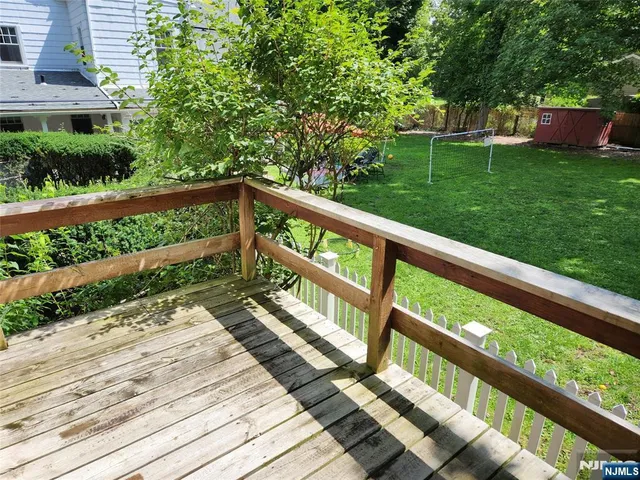 a view of house with a yard