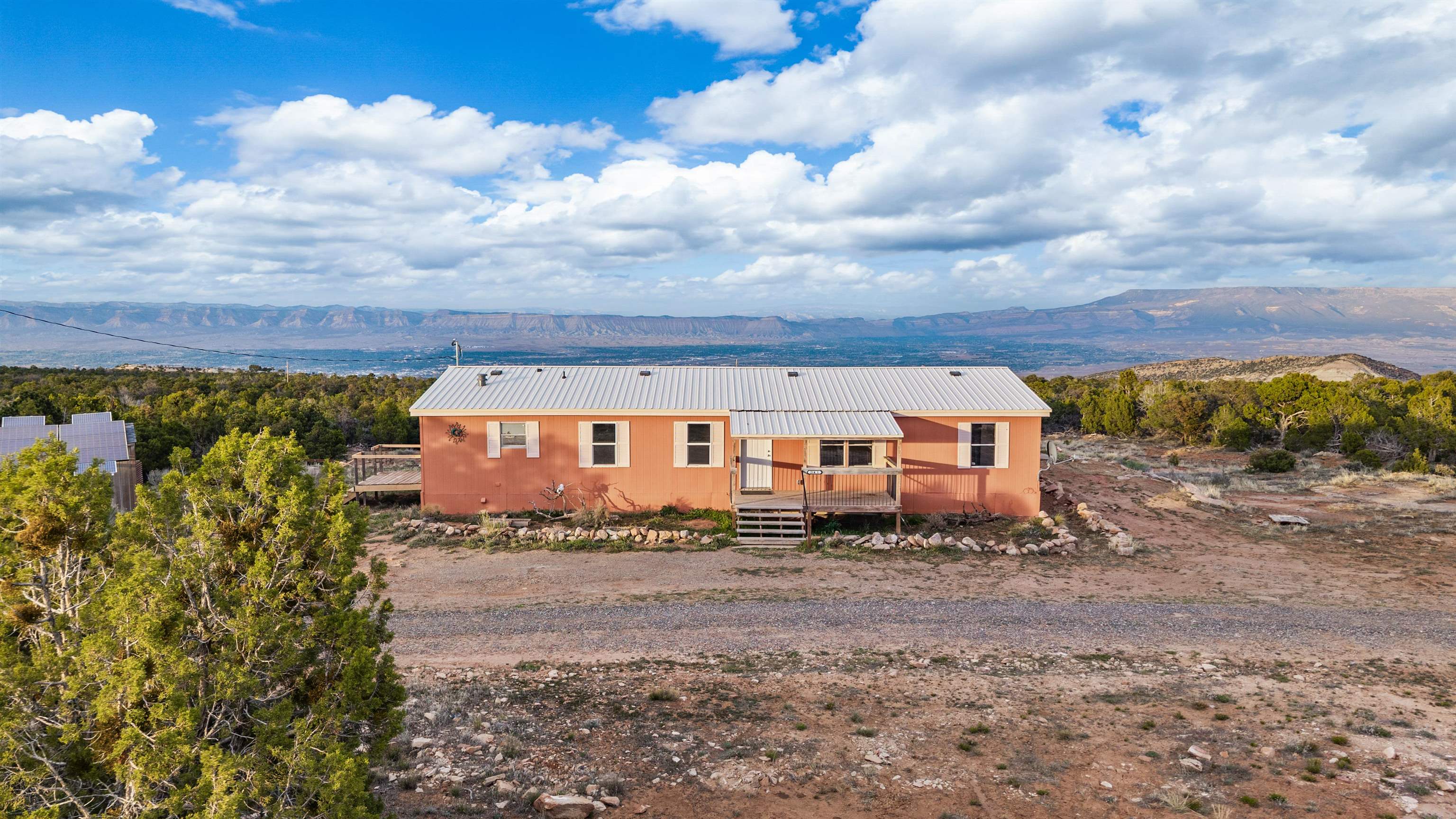21431 Little Park Road Grand Junction, CO 81507 - Photo 1 of 40 a front view of a house with a yard