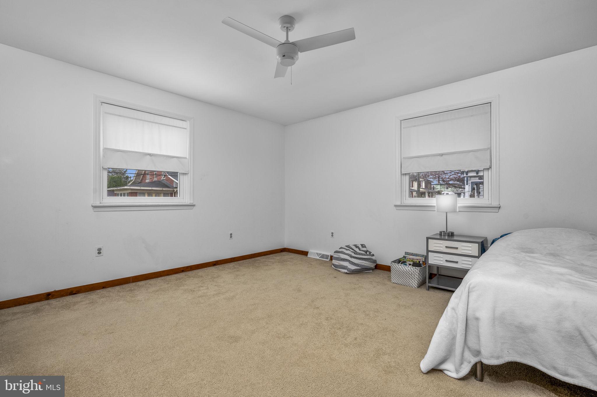 332 North Cedar Street Lititz, PA 17543 - Photo 18 of 30 a bedroom with bed and painting on the wall