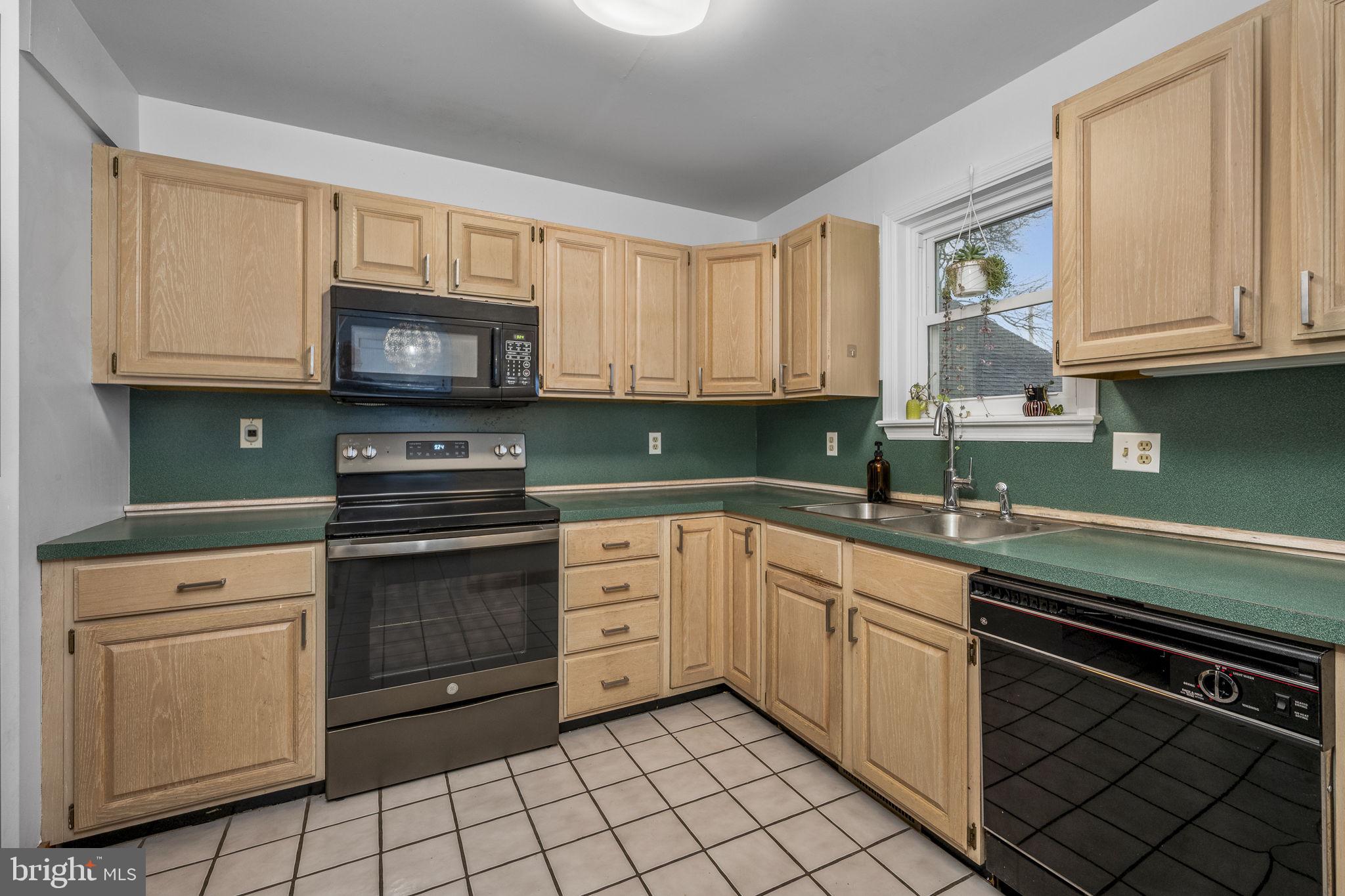 332 North Cedar Street Lititz, PA 17543 - Photo 7 of 30 a kitchen with cabinets appliances and a sink
