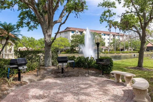 a view of a lake in middle of a house with a lake view and mountain view