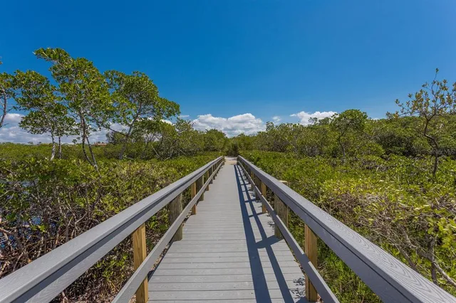 a view of house with outdoor seating and green space