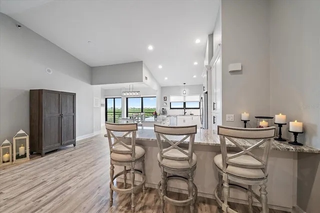 a dining room with furniture and wooden floor