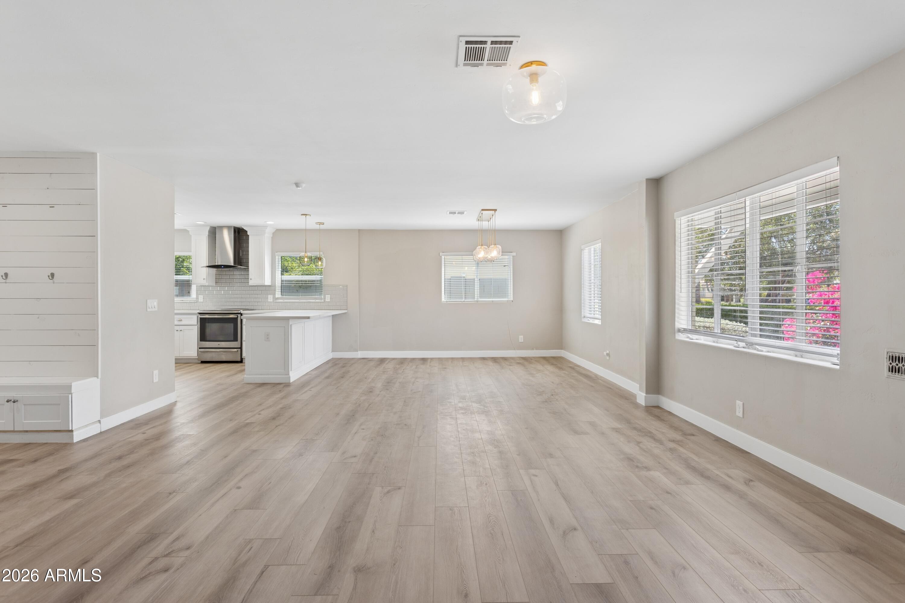 322 West Coronado Road Phoenix, AZ 85003 - Photo 3 of 93 a view of a kitchen with wooden floor and a window