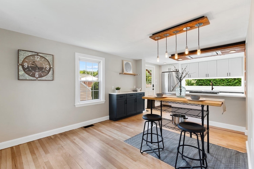 10 Wolcott Street Wakefield, MA 01880 - Photo 17 of 42 a room with furniture and a wooden floor