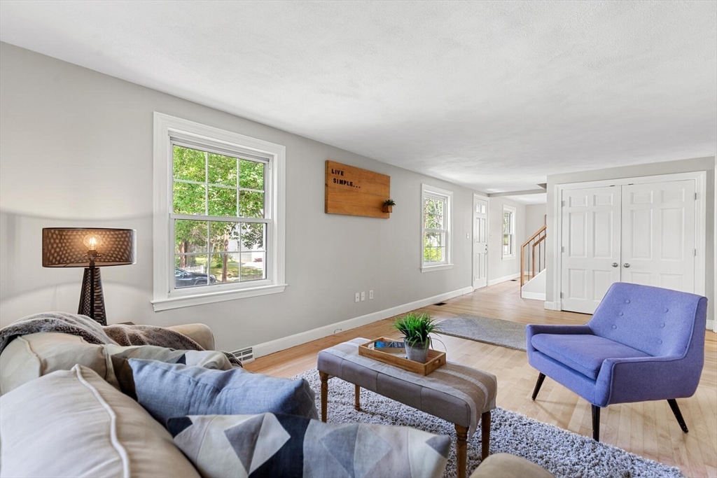 10 Wolcott Street Wakefield, MA 01880 - Photo 18 of 42 a living room with furniture and a lamp