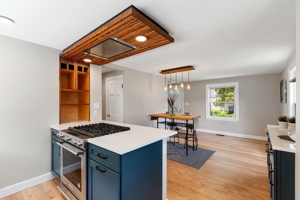 10 Wolcott Street Wakefield, MA 01880 - Photo 24 of 42 a dining room with wooden floor and a window