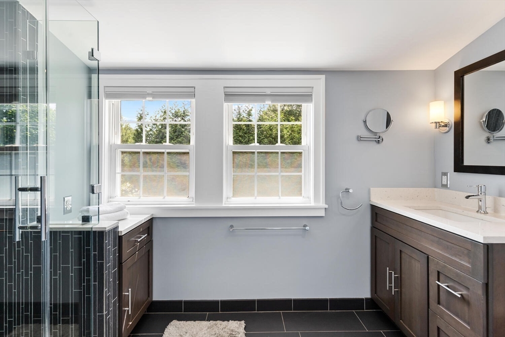 10 Wolcott Street Wakefield, MA 01880 - Photo 27 of 42 a bathroom with a sink and a mirror