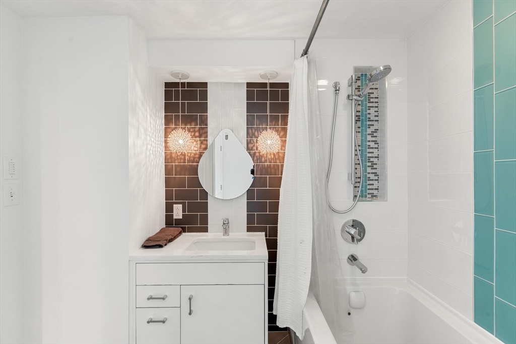 10 Wolcott Street Wakefield, MA 01880 - Photo 28 of 42 a bathroom with a toilet sink and shower