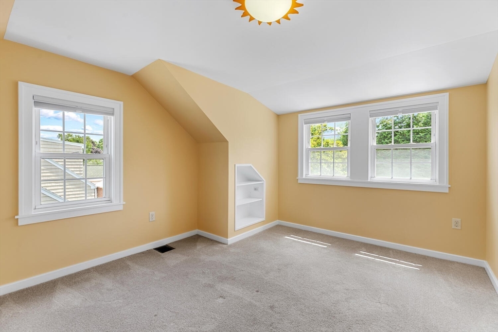 10 Wolcott Street Wakefield, MA 01880 - Photo 32 of 42 a view of an empty room with a window