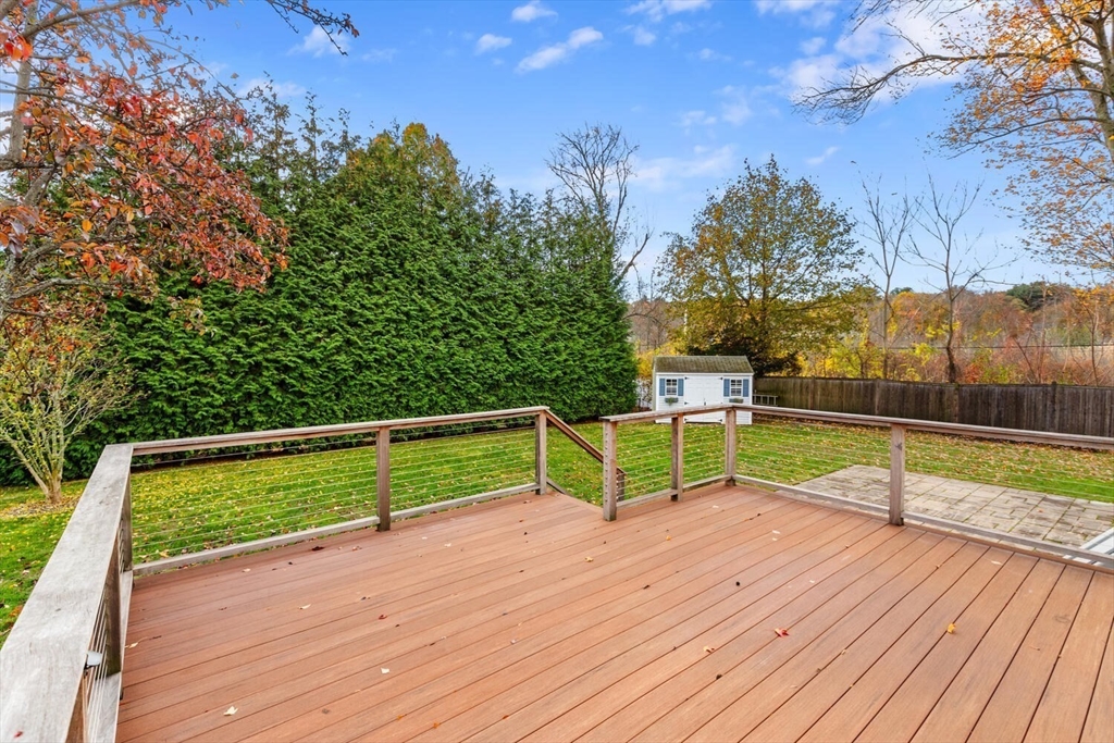 10 Wolcott Street Wakefield, MA 01880 - Photo 34 of 42 a wooden bench sitting on top of a wooden floor