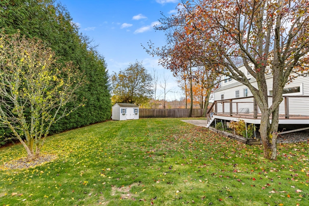 10 Wolcott Street Wakefield, MA 01880 - Photo 39 of 42 a house with trees in the background
