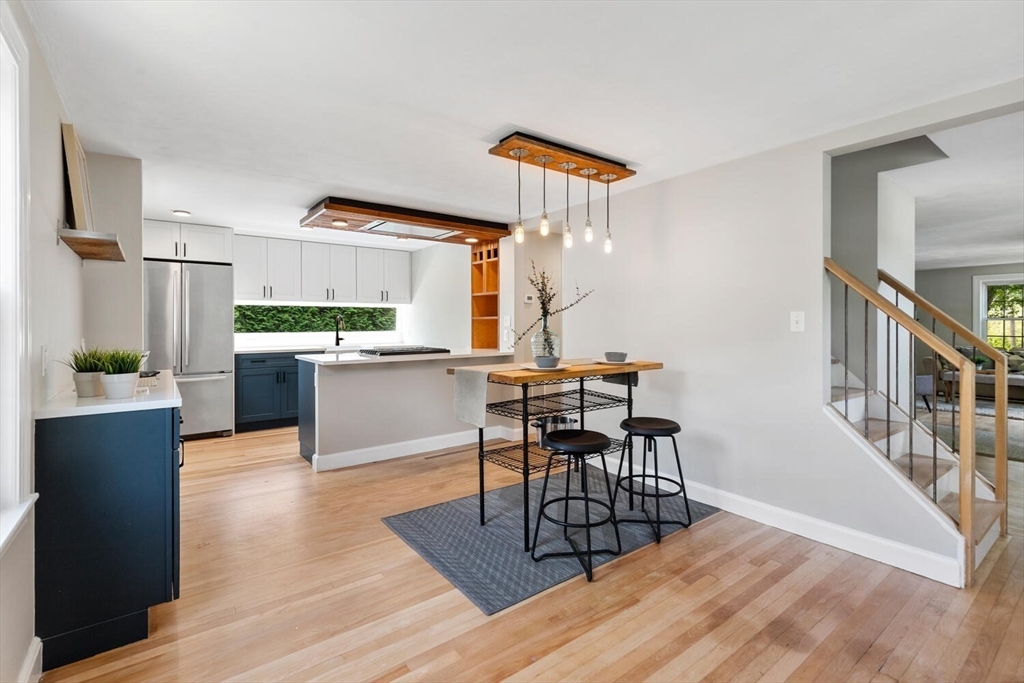 10 Wolcott Street Wakefield, MA 01880 - Photo 6 of 42 a view of a dining room with furniture window and wooden floor