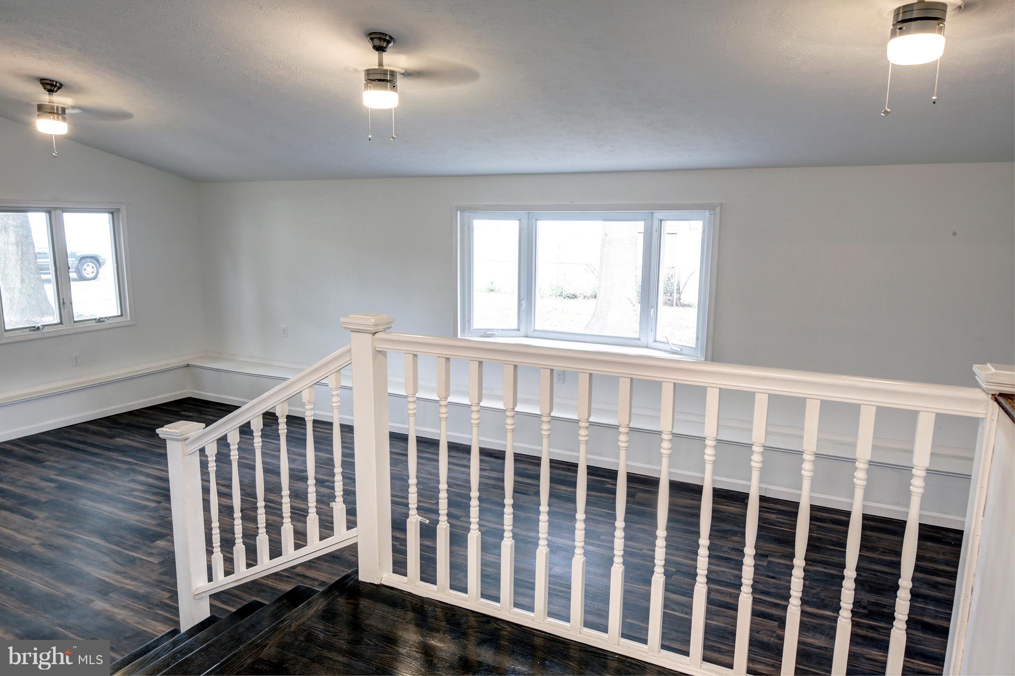 238 Dale Road Pasadena, MD 21122 - Photo 8 of 27 Family Room - cathedral ceiling and 1st floor laun