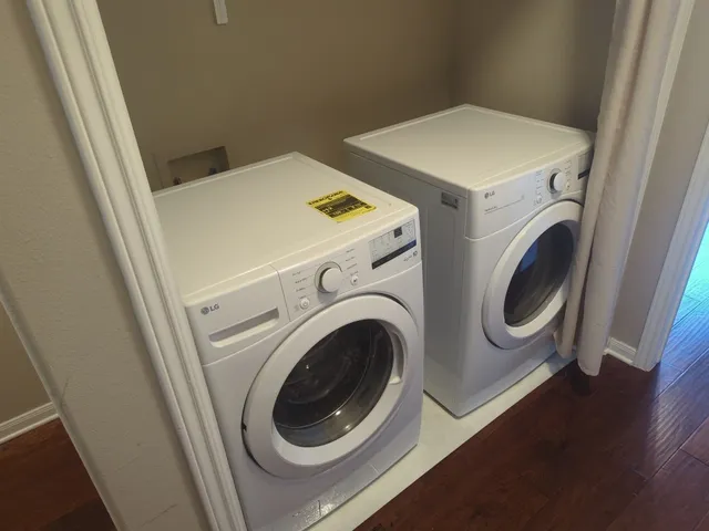 a utility room with dryer and washer