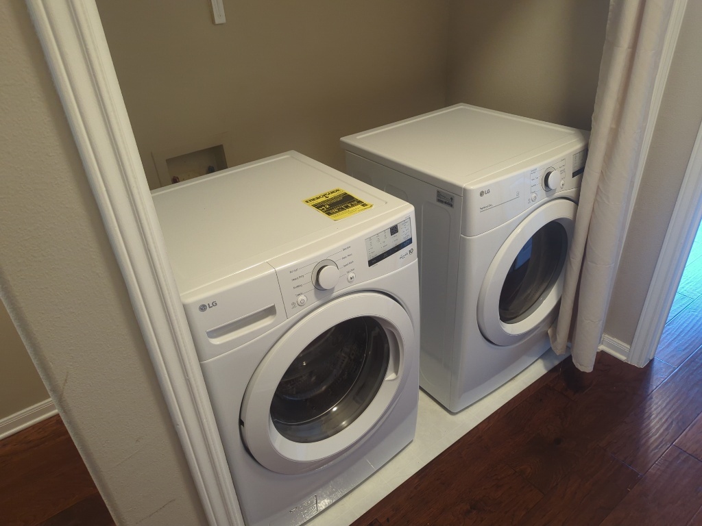 3300 Forest Creek Drive, Unit 26 Round Rock, TX 78664 - Photo 18 of 21 a utility room with dryer and washer