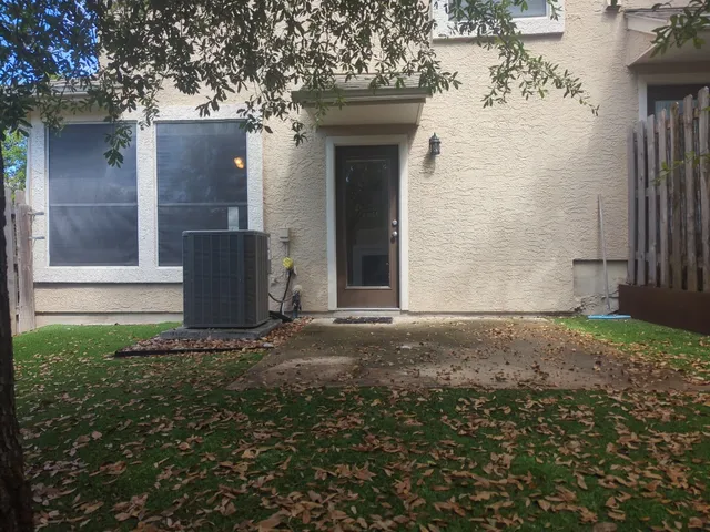 a view of door of house and yard