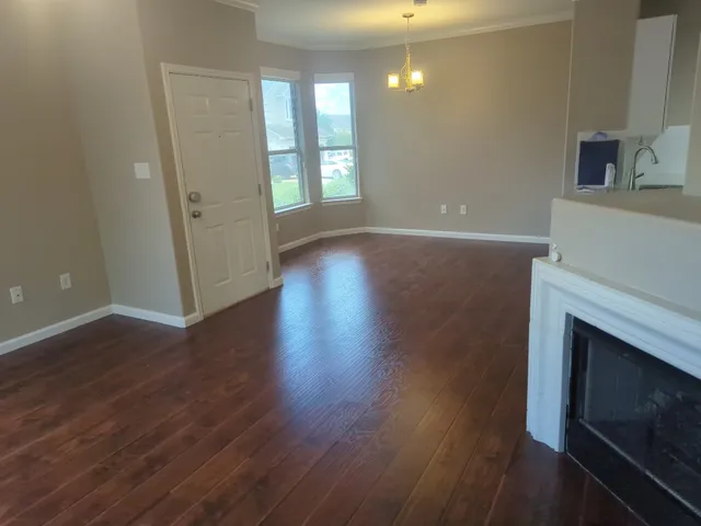 a view of livingroom with hardwood floor and fireplace