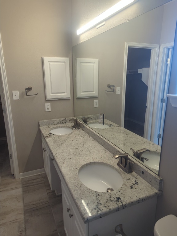 3300 Forest Creek Drive, Unit 26 Round Rock, TX 78664 - Photo 10 of 21 a bathroom with a granite countertop sink and a mirror
