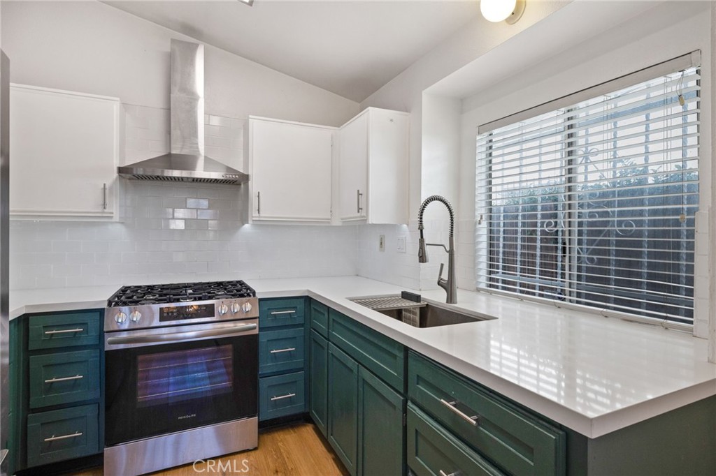 a kitchen with a sink and cabinets
