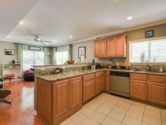 3009 Speedway, Unit 2 Austin, TX 78705 - Photo 1 of 10 Granite counters and light wood cabinetry define this well-appointed kitchen.