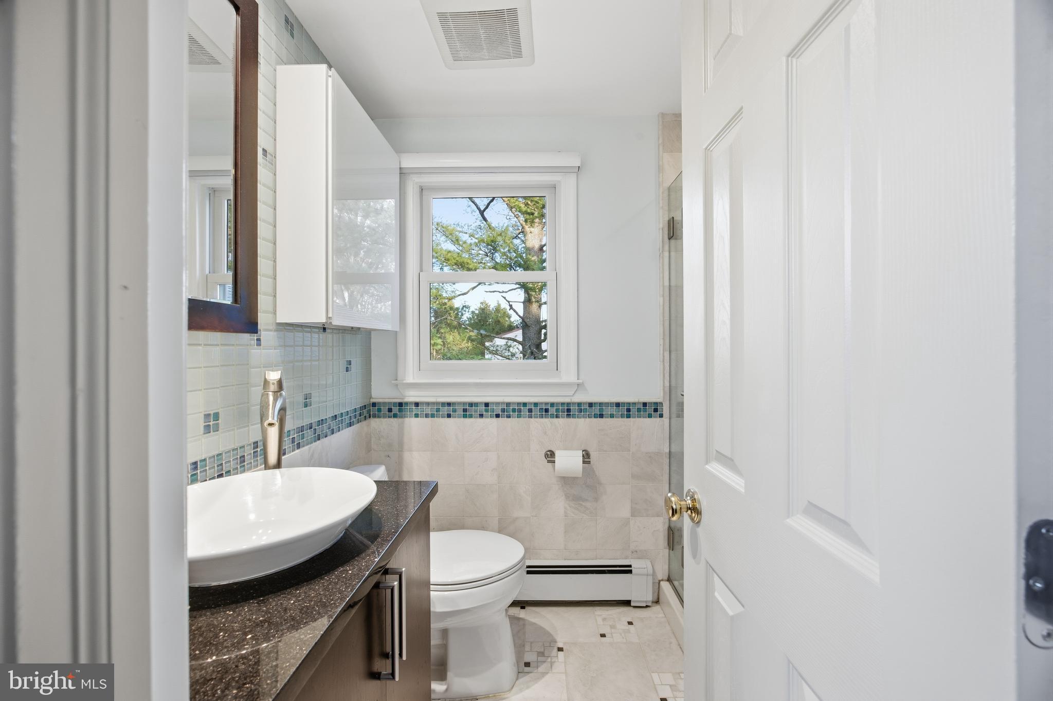 460 Rocksville Road Southampton, PA 18966 - Photo 21 of 59 a bathroom with a granite countertop toilet a sink and a bathtub