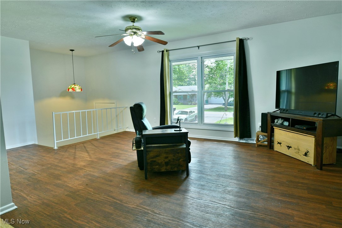 234 Howland Wilson Road Northeast Warren, OH 44484 - Photo 5 of 37 Sitting room with ceiling fan, a textured ceiling, and wood finished floors